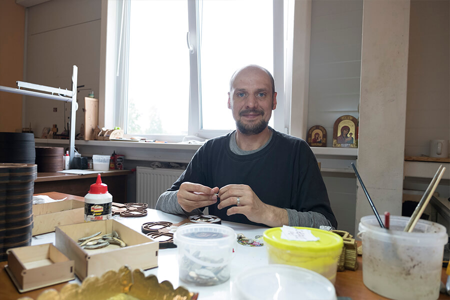 Ruslan Gurin in laser engraving workshop